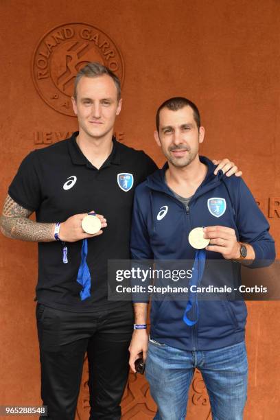 Handball players Valentin Porte and Michael Guigou attend the 2018 French Open - Day Six at Roland Garros on June 1, 2018 in Paris, France.