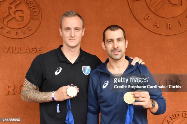 Handball players Valentin Porte and Michael Guigou attend the 2018 French Open - Day Six at Roland Garros on June 1, 2018 in Paris, France.