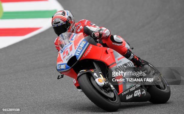 Ducati Team's Italian rider Michele Pirro steers his bike during a free practice session ahead of the Italian MotoGP Grand Prix at the Mugello...