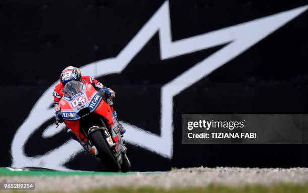 Ducati Team's Italian Andrea Dovizioso steers his bike during a free practice session ahead of the Italian MotoGP Grand Prix at the Mugello racetrack...