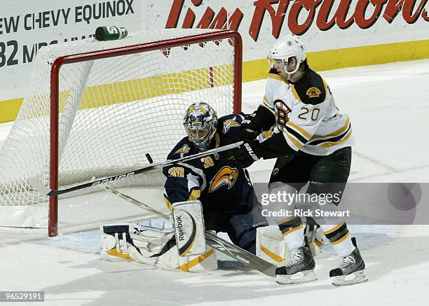 Daniel Paille of the Boston Bruins deflects the puck past Ryan Miller of the Buffalo Sabres for Paille's second goal in the first period at HSBC...