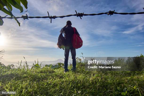 man standing in top of the mountain - tagaytay stock pictures, royalty-free photos & images