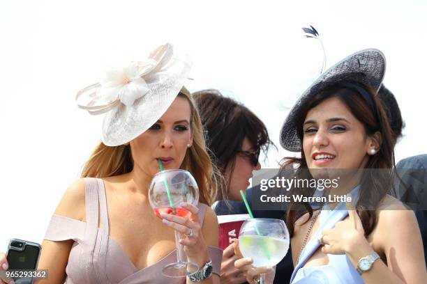 Racegoers look on during Ladies Day of the Investec Derby Festival at Epsom Downs on June 1, 2018 in Epsom, England.