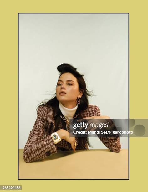 Model Isis Bataglia poses at a fashion shoot for Madame Figaro on October 11, 2017 in Paris, France. Earrings, necklace and ring on right hand by...