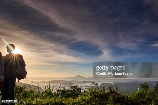 sunset view in top of a mountain with couple - tagaytay stock pictures, royalty-free photos & images
