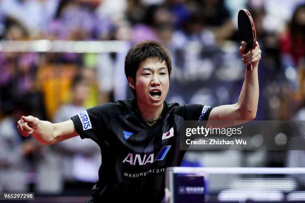 Mizutani Jun of Japan in action at the men's singles match Round of 16 compete with Wong Chun Ting of Hong Kong China during the 2018 ITTF World Tour...