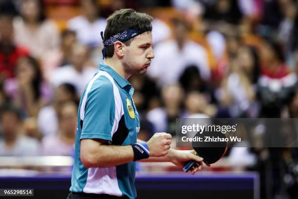 Timo Boll of Germany in action at the men's singles match Round of 16 compete with Liang Jingkun of China during the 2018 ITTF World Tour China Open...