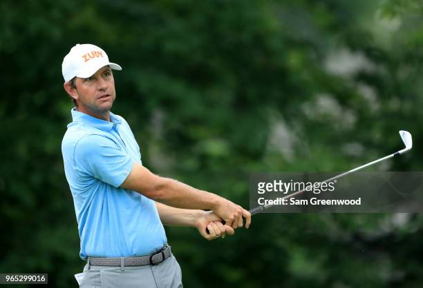 Lucas Glover of the United States watches his tee shot on the 14th hole during the second round of The Memorial Tournament Presented by Nationwide at...