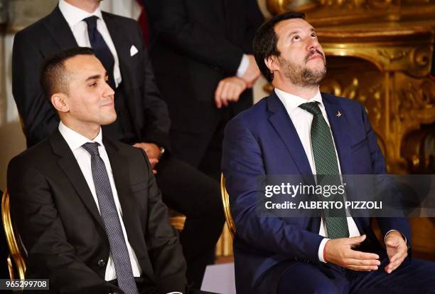 Italy's Interior Minister and deputy PM Matteo Salvini gestures next to Italy's Labor and Industry Minister and deputy PM Luigi Di Maio during the...