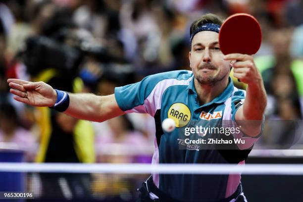 Timo Boll of Germany in action at the men's singles match Round of 16 compete with Liang Jingkun of China during the 2018 ITTF World Tour China Open...