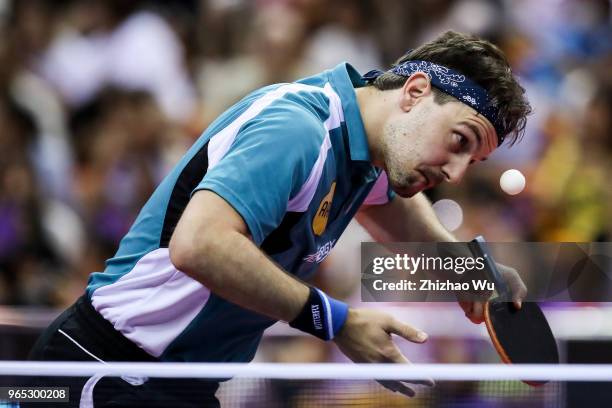 Timo Boll of Germany in action at the men's singles match Round of 16 compete with Liang Jingkun of China during the 2018 ITTF World Tour China Open...