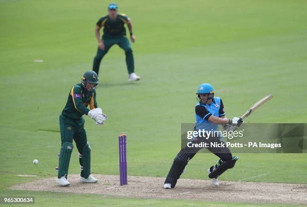 Worcestershire's Daryl Mitchell hits the ball past Nottinghamshire wicketkeeper Tom Moores during Royal London One Day Cup north group match at Trent...