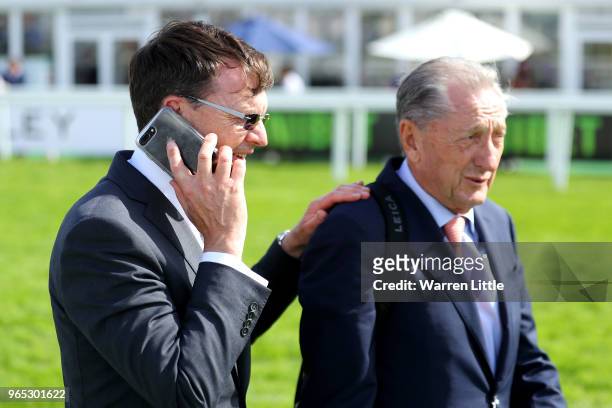 Aidan O'Brien, trainer of Forever Together and part owner Derrick Smith celebrate winning the Investec Oaks during Ladies Day of the Investec Derby...