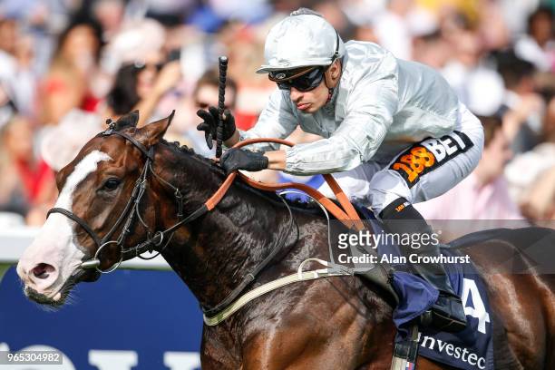 Silvestre De Sousa riding Lake Volta win The Investec Surrey Stakes during the Investec Ladies Day at Epsom Downs Racecourse on June 1, 2018 in...