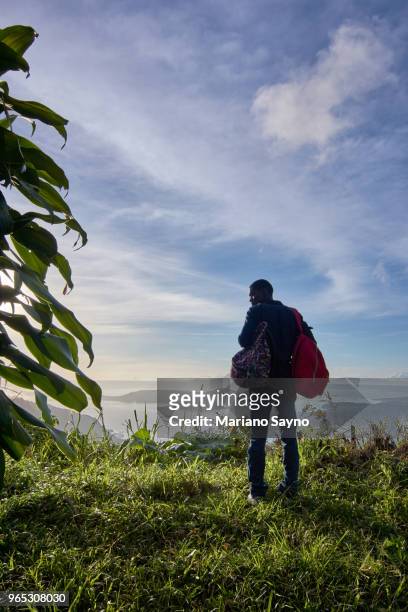 man standing in top of the mountain - tagaytay stock pictures, royalty-free photos & images