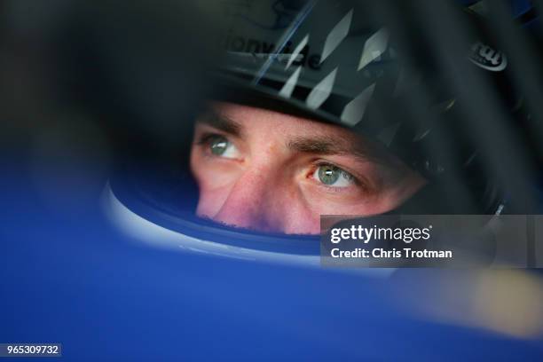 Alex Bowman, driver of the Nationwide Chevrolet, sits in his car during practice for the Monster Energy NASCAR Cup Series Pocono 400 at Pocono...