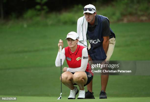 Sarah Smith of Australia sand caddie/husband Duane Smith look over the 15th green during the second round of the 2018 U.S. Women's Open at Shoal...