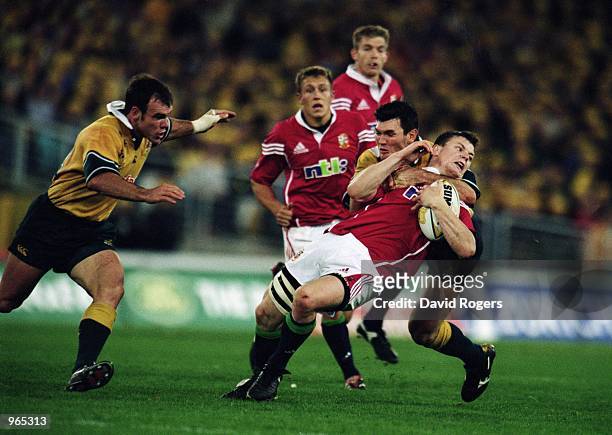 Brian O''Driscoll of the Lions is tackled high by Australia's Daniel Herbert during the Second Test Match between the Australian Wallabies and the...