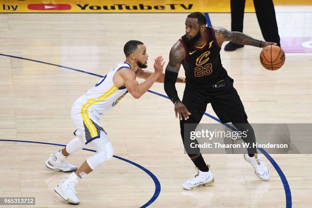 LeBron James of the Cleveland Cavaliers drives against Stephen Curry of the Golden State Warriors in Game 1 of the 2018 NBA Finals at ORACLE Arena on...