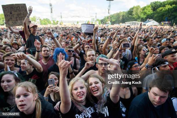Fans celebrate the performance of the Berlin Hip-Hop-Band 'Trailerpark' at Rock im Park 2018 festival at Zeppelinfeld on June 1, 2018 in Nuremberg,...