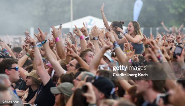Fans celebrate the performance of the Berlin Hip-Hop-Band 'Trailerpark' at Rock im Park 2018 festival at Zeppelinfeld on June 1, 2018 in Nuremberg,...