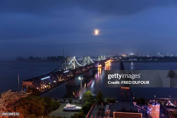 Picture taken of the 'Friendship Bridge' in the Chinese border town of Dandong, in China's northeast Liaoning province, on May 29, 2018. - The city...