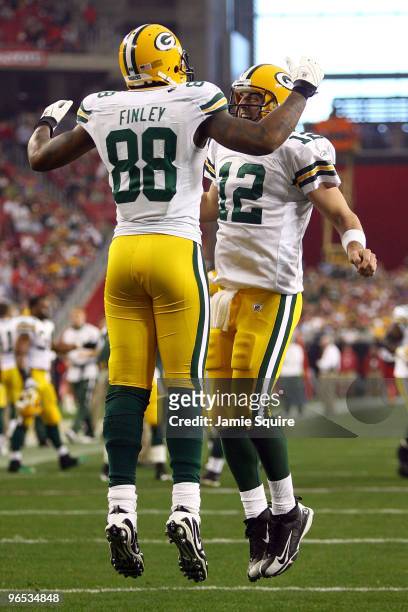 Jermichael Finley of the Green Bay Packers and quarterback Aaron Rodgers celebrate after Finley catches a five-yard touchdown against the Arizona...