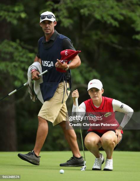 Sarah Smith of Australia sand caddie/husband Duane Smith look over the 13th green during the second round of the 2018 U.S. Women's Open at Shoal...