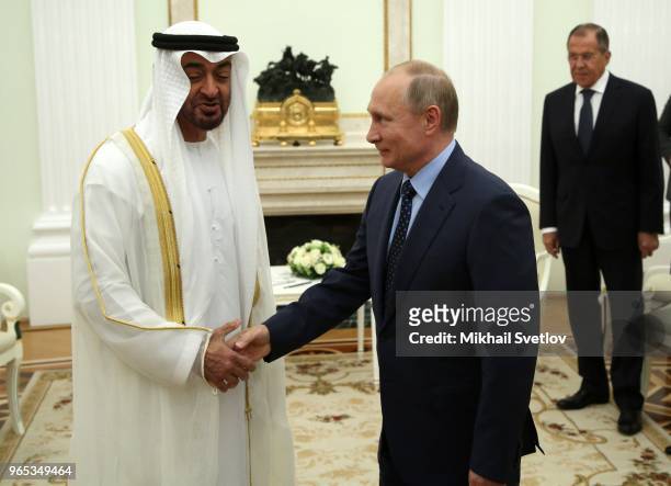 Russian President Vladimir Putin greets Abu Dhabi's Crown Prince and Deputy Supreme Commander of UAE's Armed Forces Sheikh Mohammed bin Zayed bin...