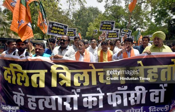 Leaders Mukul Roy , Vijay Vargiya , Manoj Tiwari and other workers protest against the murder of the 21-year-old BJP worker Trilochan Mahato at...