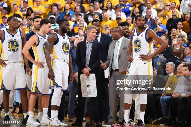 Head coach Steve Kerr and assistant coach Mike Brown of the Golden State Warriors talk in Game One of the 2018 NBA Finals against the Cleveland...