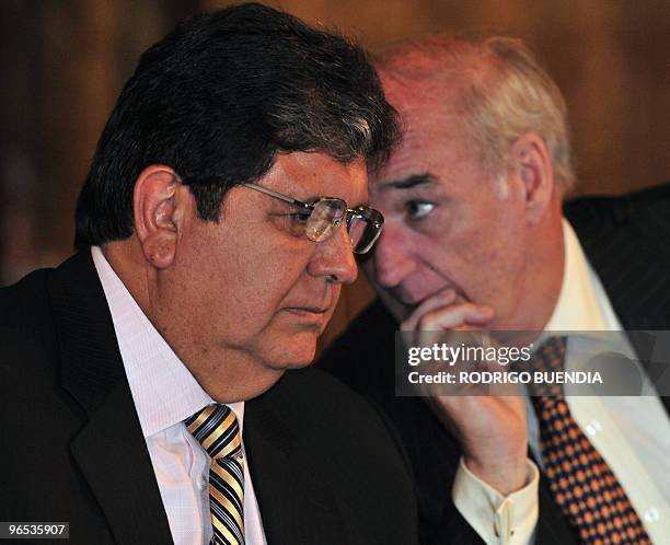 Peruvian President Alan Garcia listens to his Foreign Minister Jose Antonio Garcia Belaunde during a gathering of the Union of South American Nations...