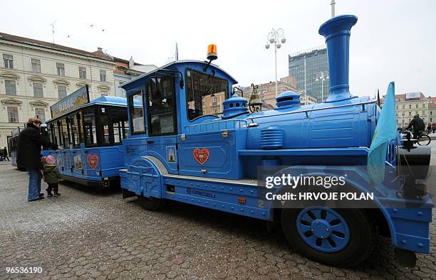 Mother takes her daughter to the kids �fake� tramway at the main square of capital Zagreb, on January 22, 2010. Many parents use this �unique�...