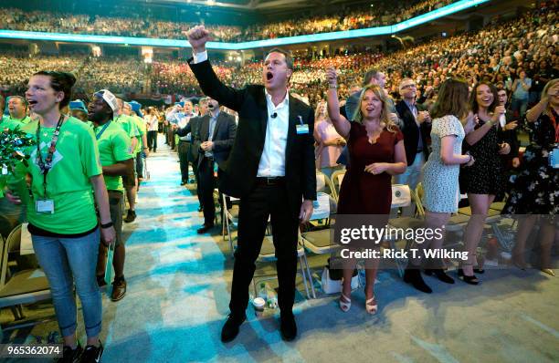 Doug McMillon, Walmart CEO, gives the Walmart cheer with wife Shelley during the annual shareholders meeting event on June 1, 2018 in Fayetteville,...