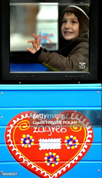 Kid looks excited as he takes a ride in a traditional Zagreb�s �fake kid� tramway at the main capital square on January 22, 2010. While kid is...