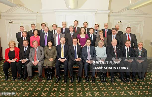 Members of the British government shadow cabinet pose for a family photo in central London on February 9, 2010. David Mundell, Lord Strathclyde, Greg...