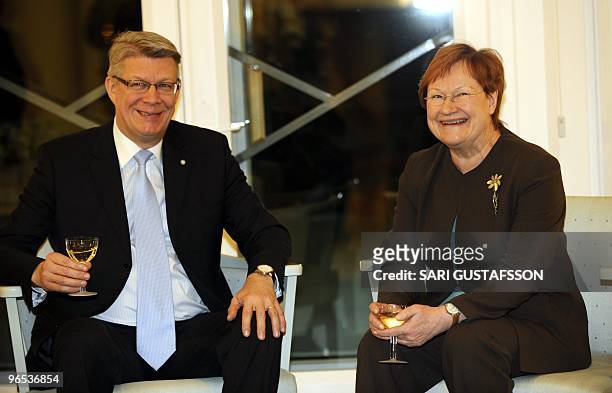 Finnish President Tarja Halonen shares a smile with her Latvian counterpart Valdis Zatlers during their meeting at the official residence Mantyniemi...
