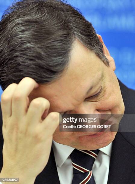 European Commission President Jose Manuel Barroso scratches his forehead during a press conference after the approbation vote by EU Parliament for...