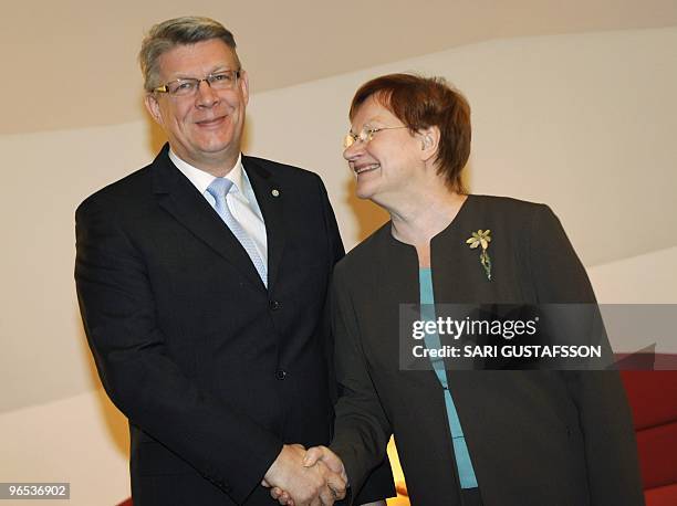 Finnish President Tarja Halonen shares a smile with her Latvian counterpart Valdis Zatlers during their meeting at the official residence Mantyniemi...