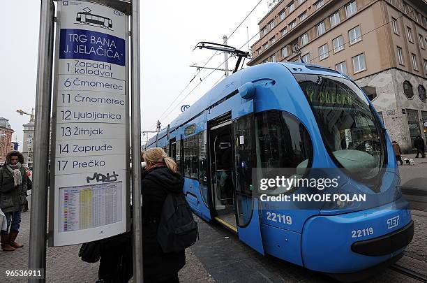 Residents of Zagreb await for the tramway at the main capital's square on January 22, 2010. Croatians feel proudly as their new tram is completely...