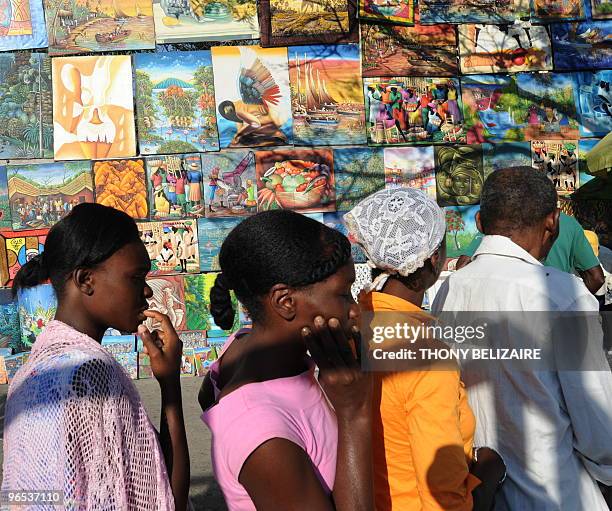 Group of people line up for mediacal aid in Petion-Ville near Port-Au-Prince on February 9, 2010 Haitian about one month from the date of the...