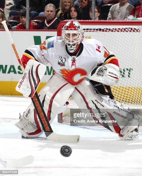 Miikka Kiprusoff of the Calgary Flames focuses on the puck in a game against the Ottawa Senators at Scotiabank Place on February 9, 2010 in Ottawa,...