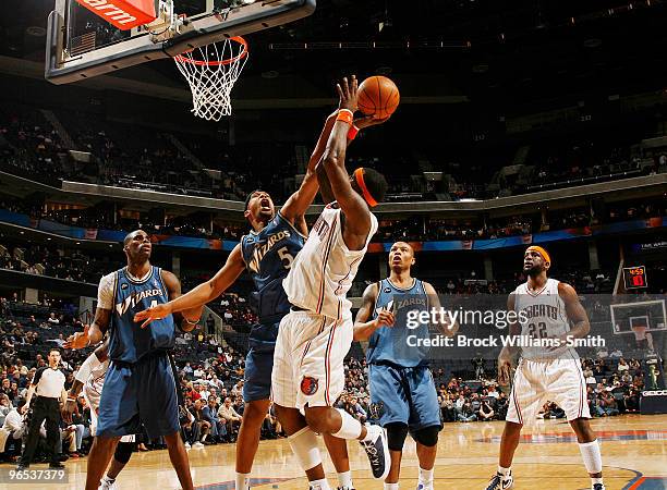 Dominic McGuire of the Washington Wizards blocks against Stephen Jackson of the Charlotte Bobcats on February 9, 2010 at the Time Warner Cable Arena...