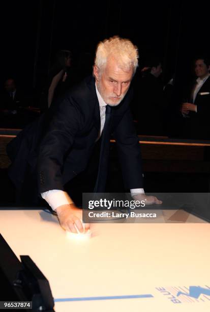 Actor John Slattery plays air hockey at the after party for the Opening of the first Hermes Men's Store on Madison Avenue at NY State Armory on...