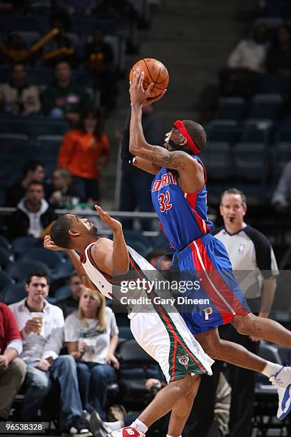 Richard Hamilton of the Detroit Pistons draws a foul against Charlie Bell of the Milwaukee Bucks on February 9, 2010 at the Bradley Center in...