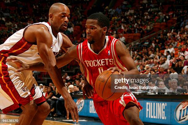 Aaron Brooks of the Houston Rockets drives against Rafer Alston of the Miami Heat on February 9, 2010 at American Airlines Arena in Miami, Florida....