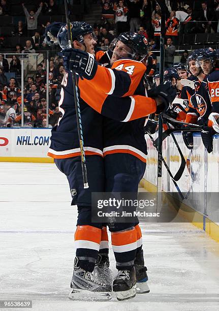 Freddy Meyer of the New York Islanders celebrates his goal against the Nashville Predators with teammate Bruno Gervais on February 9, 2010 at Nassau...