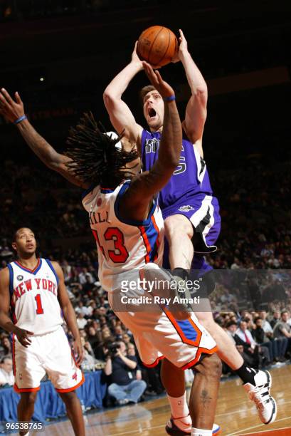 Andres Nocioni of the Sacramento Kings shoots against Jordan Hill of the New York Knicks during the game on February 9, 2010 at Madison Square Garden...