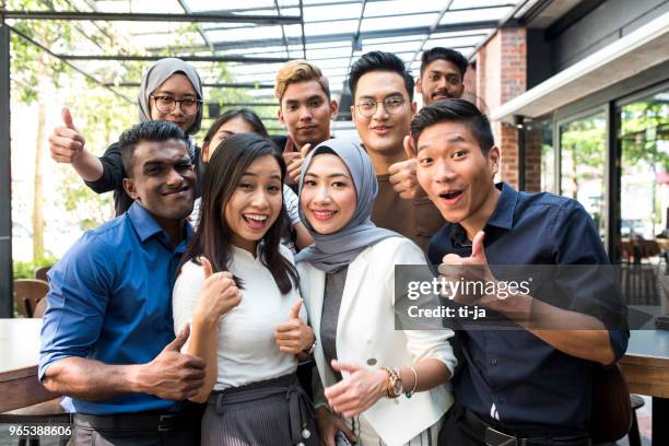 young malaysian friends - malaysian culture stock pictures, royalty-free photos & images