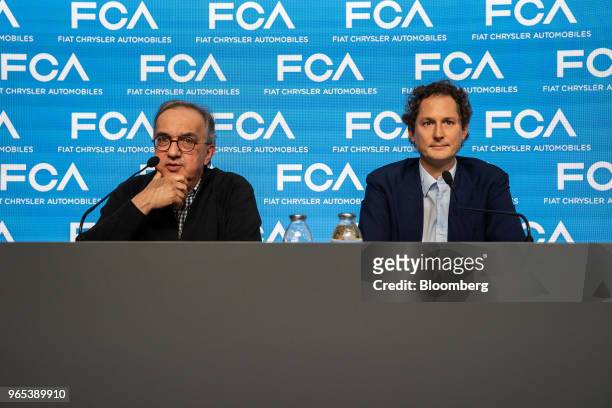 Sergio Marchionne, chief executive officer of Fiat Chrysler Automobiles NV, left, speaks as John Elkann, chairman of Fiat Chrysler Automobiles NV,...